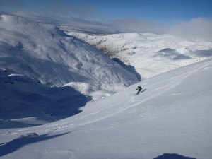 Skiing East facing slopes of the "Doolans", Remarkables back country ski touring